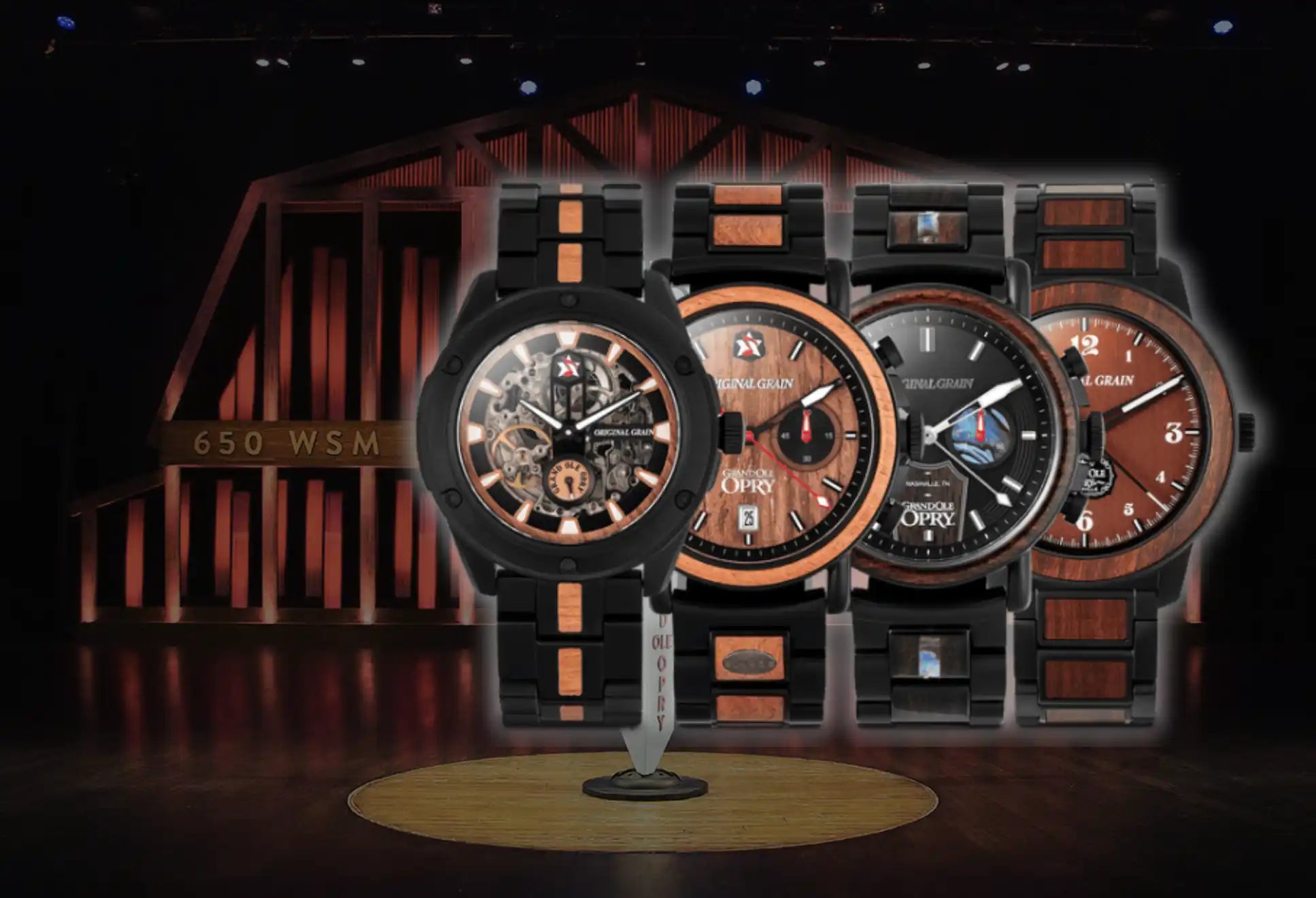 A collection of four wooden and metal watches with various face designs.