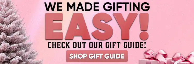 Pink gift box with white ribbon and bow, wrapped in shiny paper.