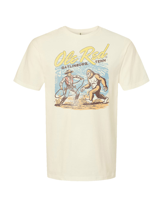 Beige t-shirt with graphic design and text on a white background