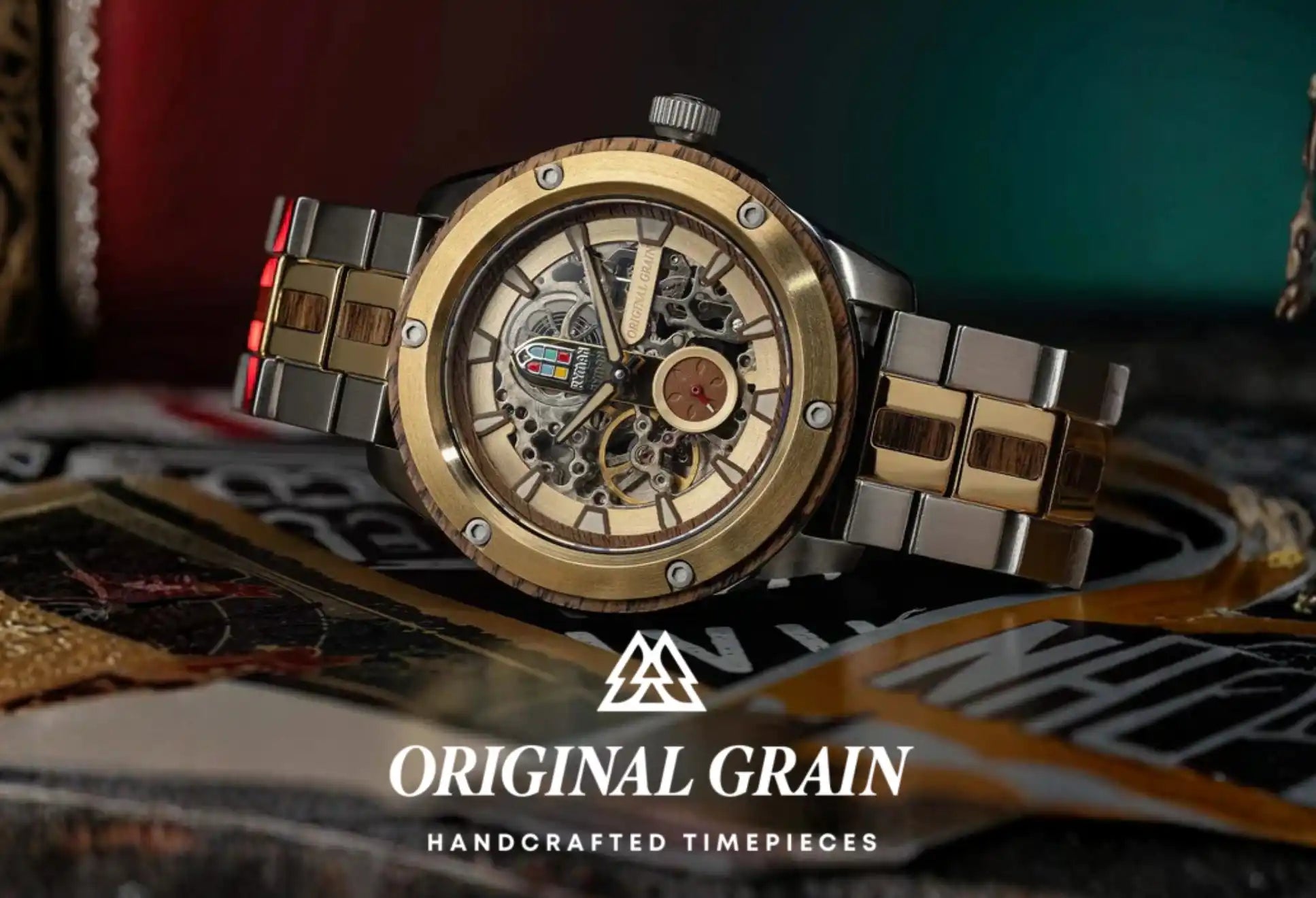 A gold and silver skeleton watch with a wooden bezel and band inserts.