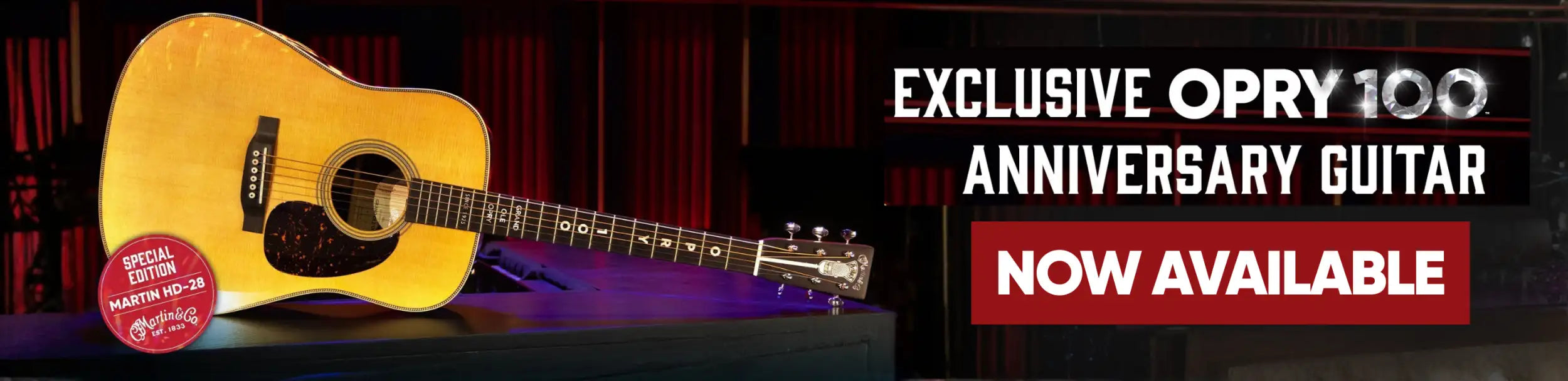 Golden acoustic guitar with a natural wood finish and black pickguard, featuring the martin hd-28 model designation.