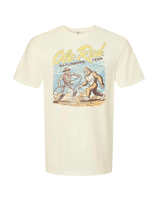 Beige t-shirt with graphic design and text on a white background