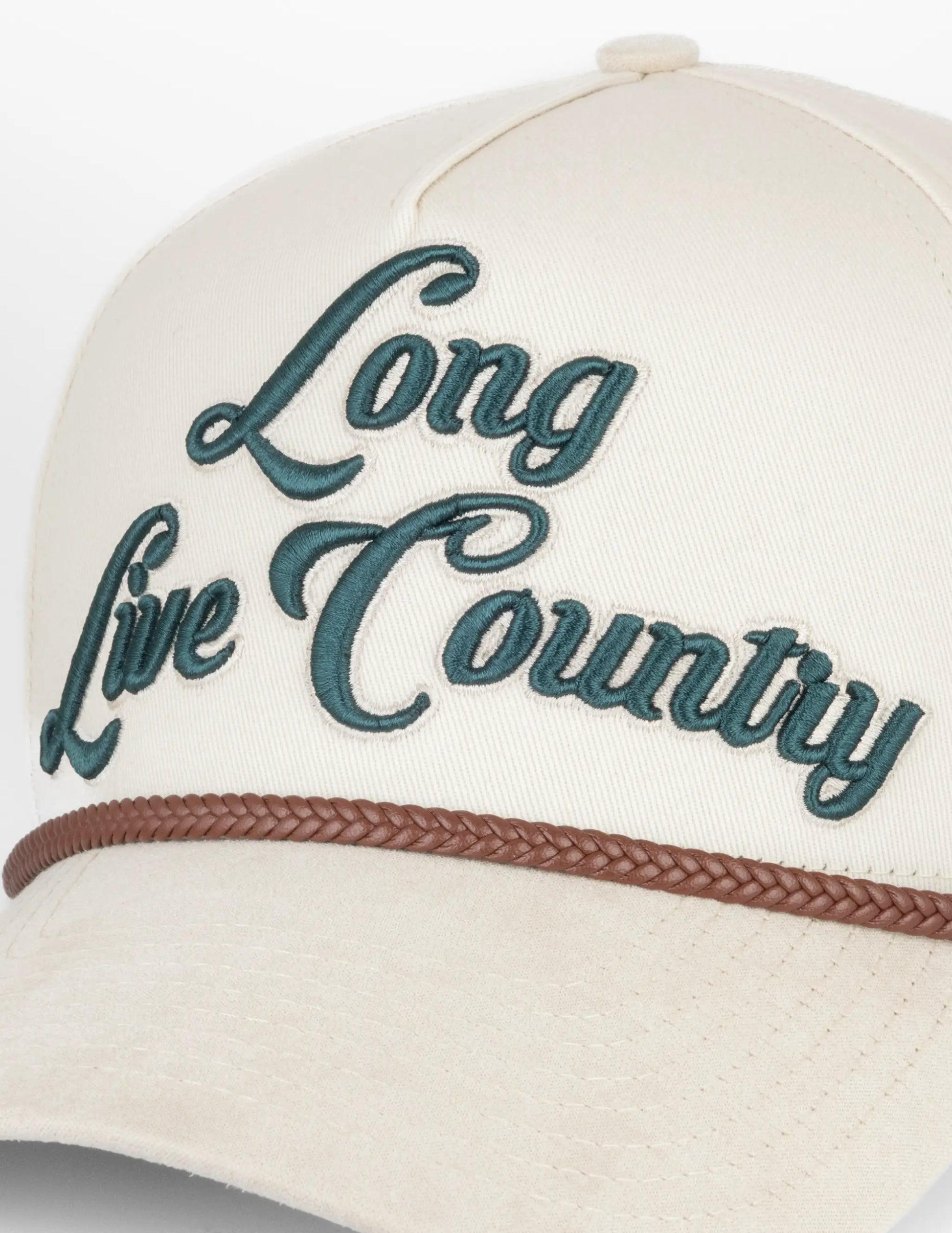 Cream-colored Opry Long Live Country baseball cap with dark teal embroidery and brown braided band