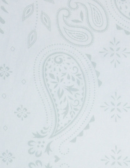 A delicate white opy paisley traveler bandana with a subtle light gray paisley pattern and intricate floral accents