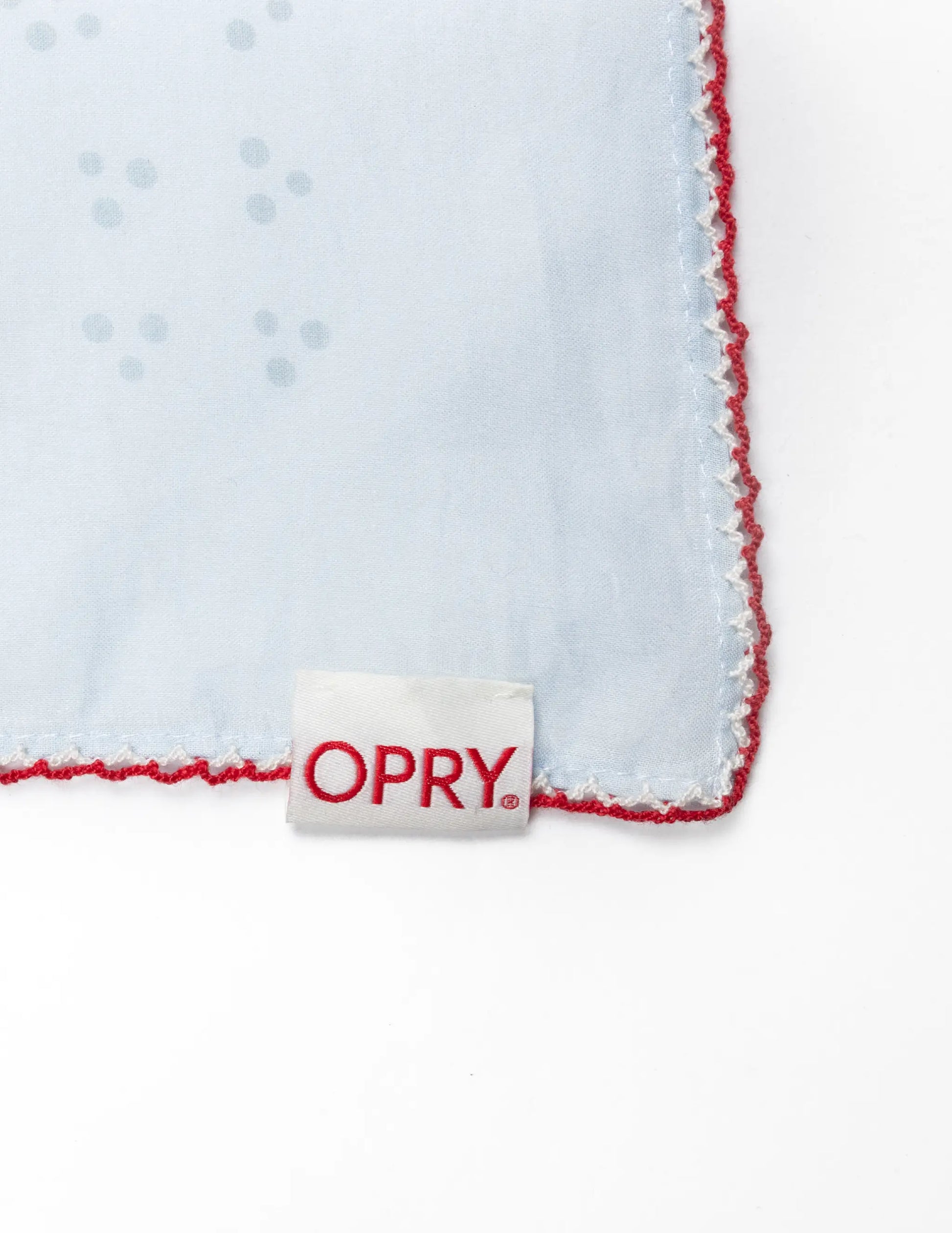Light blue microfiber opry paisley traveler bandana with red stitched edges and gray dot pattern for cleaning