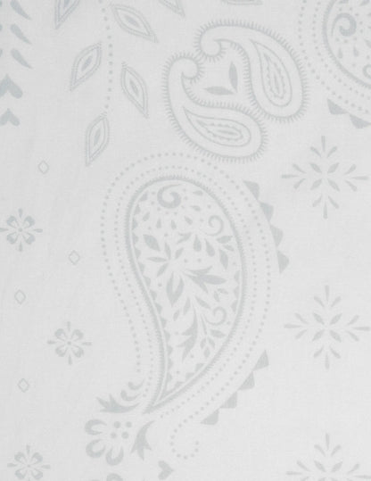 Opry paisley traveler bandana in cream with white wallpaper featuring a subtle light gray paisley floral pattern