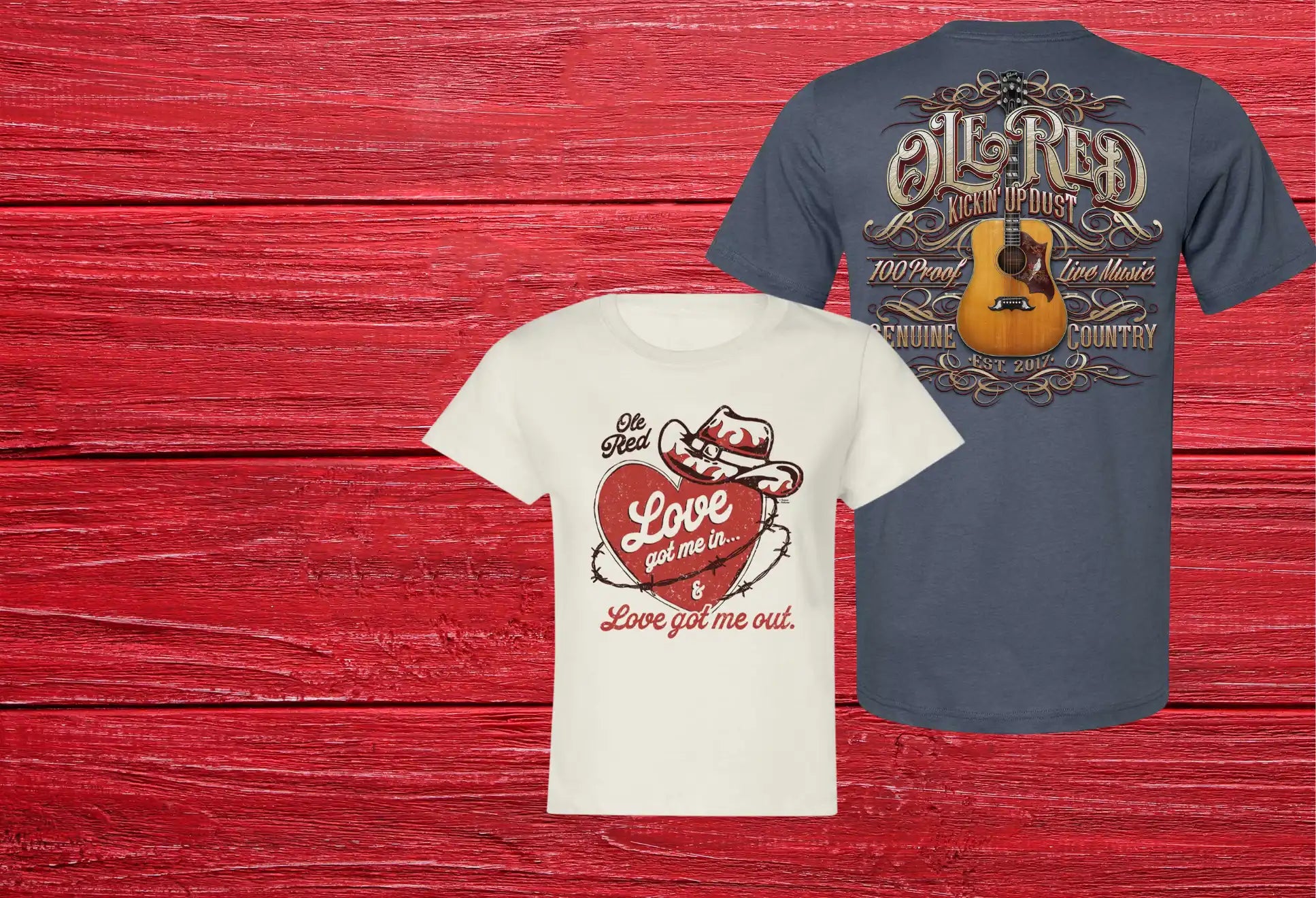 Two graphic t-shirts, one off-white with a heart and cowboy hat design, and one blue with a guitar and ’Oil Red’ text.