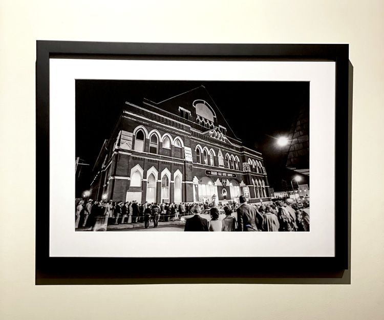Framed Black and white Print in black frame. Exterior of The Ryman with Fans Outside